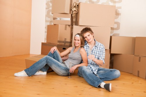 Professional movers preparing furniture for pick-up in Putney