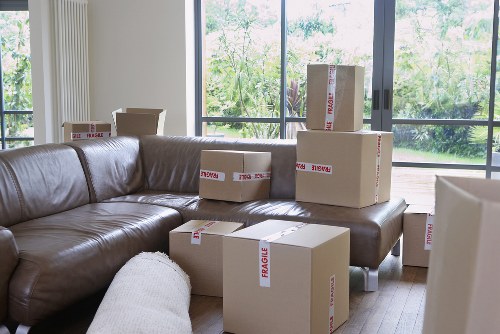 Efficient removalists handling boxes